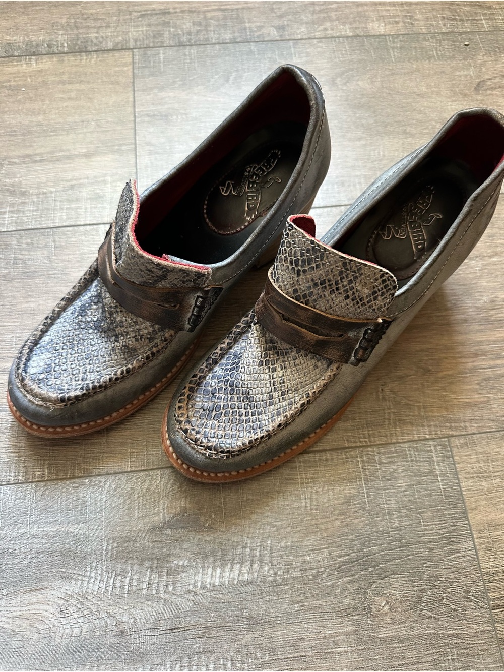 Freebird by Steven women’s Chevelle Snake-Embossed Loafers in Black and Brown